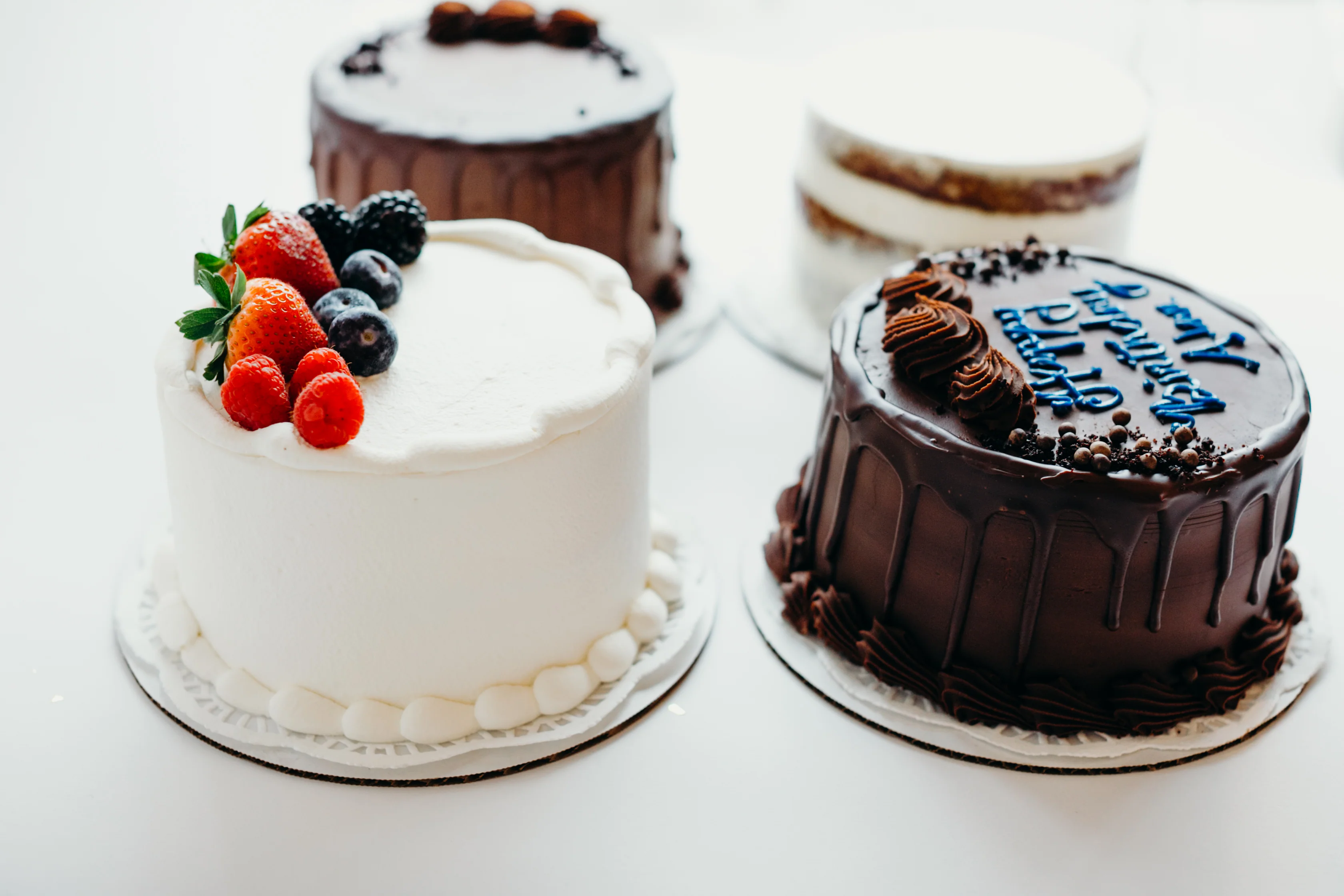Beautiful handcrafted celebration cake with smooth frosting, decorative details and artisan dessert styling